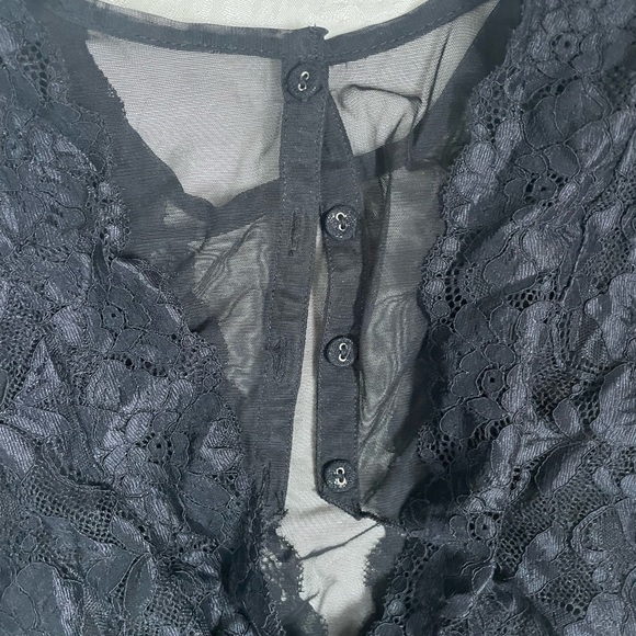 Lacey black short sleeve body suit with mesh deep V. It has four buttons in back - Picture 4 of 4